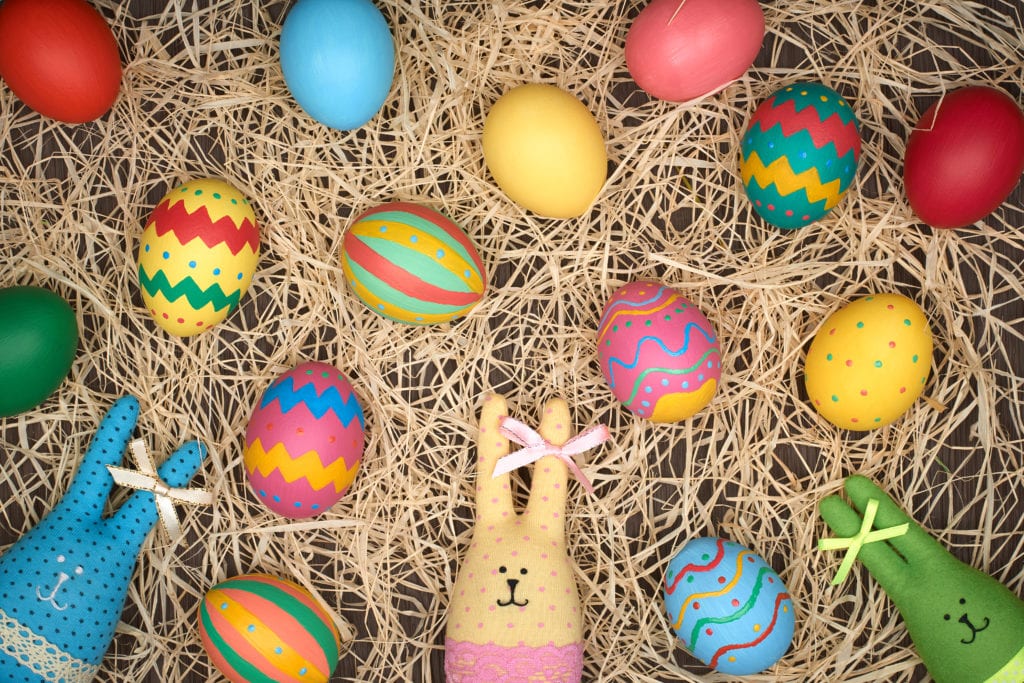Easter eggs hand painted, rabbits, wood background
